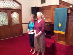 Wyndy McRoy and Rev. Leslie Limbaugh wait to greet congregational members at the end of the Sept. 29, service.